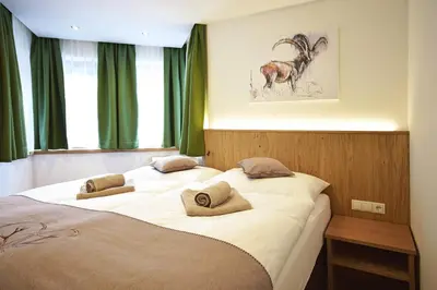 Ein Bett oder Betten in einem Zimmer der Unterkunft Waidmannsruh Appartements