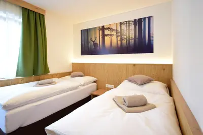 Ein Bett oder Betten in einem Zimmer der Unterkunft Waidmannsruh Appartements