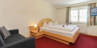 Ein Bett oder Betten in einem Zimmer der Unterkunft Pension Eder - Joker card included in summer