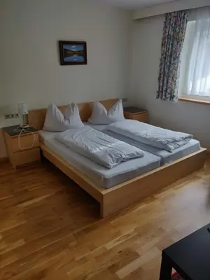 Ein Bett oder Betten in einem Zimmer der Unterkunft Pension Eder - Joker card included in summer