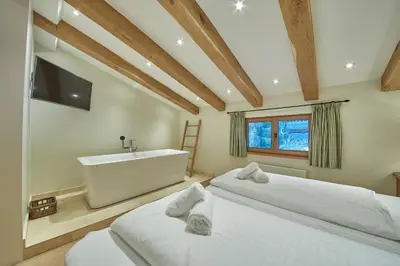 Ein Bett oder Betten in einem Zimmer der Unterkunft Chalet Tannenbaum