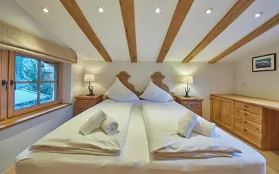 Ein Bett oder Betten in einem Zimmer der Unterkunft Chalet Tannenbaum
