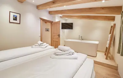 Ein Bett oder Betten in einem Zimmer der Unterkunft Chalet Tannenbaum