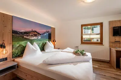 Ein Bett oder Betten in einem Zimmer der Unterkunft Gästehaus Hochstaffl