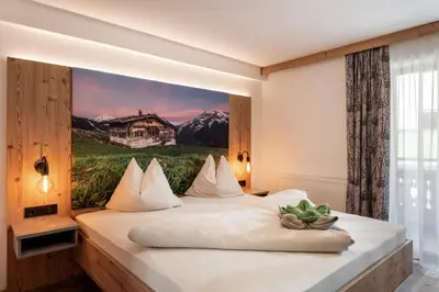 Ein Bett oder Betten in einem Zimmer der Unterkunft Gästehaus Hochstaffl