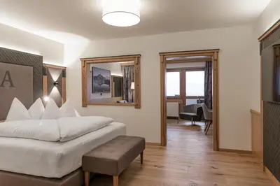 Ein Bett oder Betten in einem Zimmer der Unterkunft Hotel Alpina Wellness & Spa Resort