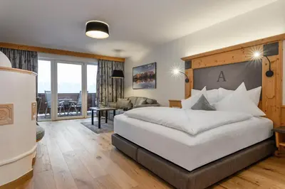 Ein Bett oder Betten in einem Zimmer der Unterkunft Hotel Alpina Wellness & Spa Resort