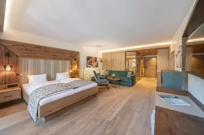 Ein Bett oder Betten in einem Zimmer der Unterkunft Alpbacherhof Mountain & Spa Resort