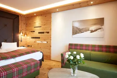 Ein Bett oder Betten in einem Zimmer der Unterkunft Alpbacherhof Mountain & Spa Resort