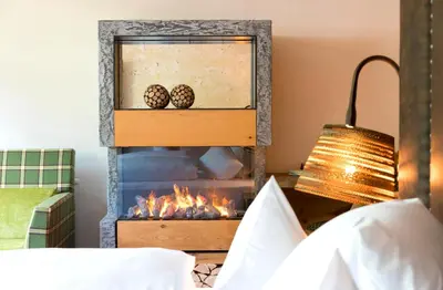 Ein Bett oder Betten in einem Zimmer der Unterkunft Alpbacherhof Mountain & Spa Resort