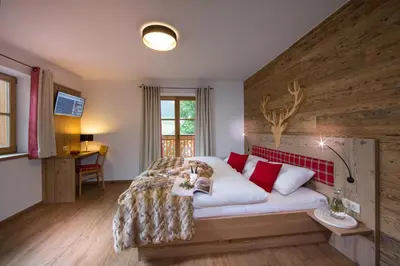 Ein Bett oder Betten in einem Zimmer der Unterkunft Bachgut - Das Resort am Berg