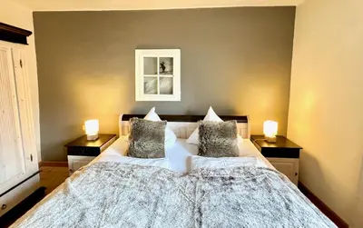 Ein Bett oder Betten in einem Zimmer der Unterkunft Kitzbühel Apartments Haus Brugger