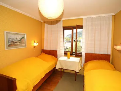 Ein Bett oder Betten in einem Zimmer der Unterkunft Chalet Patricia by Interhome