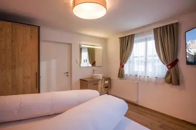 Ein Bett oder Betten in einem Zimmer der Unterkunft Kaiser Chalet