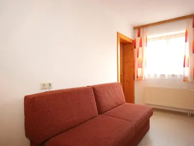 Ein Sitzbereich in der Unterkunft Apartment Gasteighof-4 by Interhome
