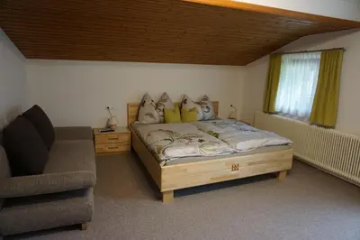 Ein Bett oder Betten in einem Zimmer der Unterkunft Habachschmied Familie Gruber