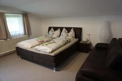 Ein Bett oder Betten in einem Zimmer der Unterkunft Habachschmied Familie Gruber
