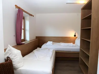 Ein Bett oder Betten in einem Zimmer der Unterkunft Farmhouse in Söll near Wilder Kaiser Ski Area