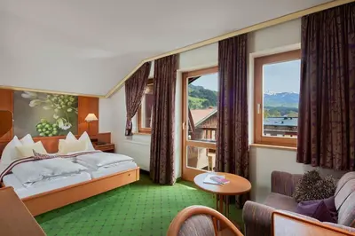 Ein Bett oder Betten in einem Zimmer der Unterkunft Wanderhotel Kirchner