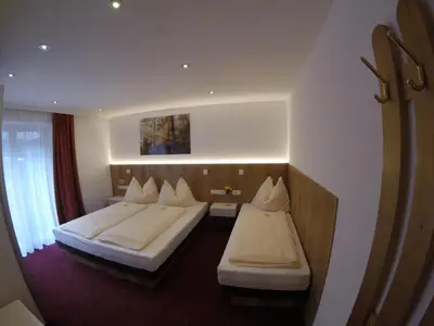 Ein Bett oder Betten in einem Zimmer der Unterkunft Komfort Appartements Talbach