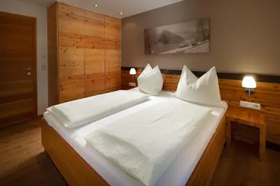 Ein Bett oder Betten in einem Zimmer der Unterkunft Gästehaus Vorderegger