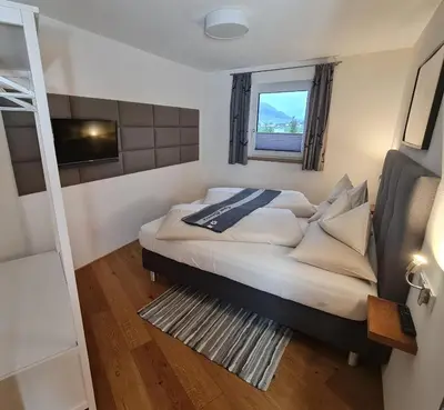 Ein Bett oder Betten in einem Zimmer der Unterkunft Dahoam by Tani