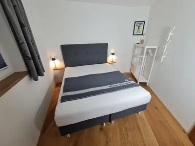 Ein Bett oder Betten in einem Zimmer der Unterkunft Dahoam by Tani