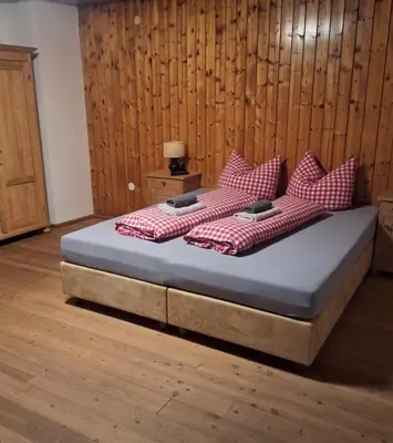 Ein Bett oder Betten in einem Zimmer der Unterkunft Uhlerhof
