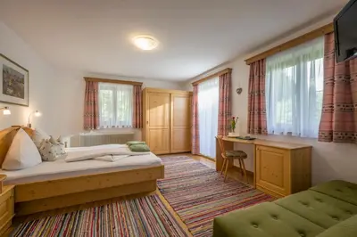 Ein Bett oder Betten in einem Zimmer der Unterkunft Urlaub am Bauernhof Windhaghof