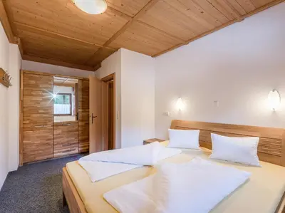 Ein Bett oder Betten in einem Zimmer der Unterkunft Appartementhaus Talwinkel