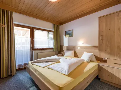 Ein Bett oder Betten in einem Zimmer der Unterkunft Appartementhaus Talwinkel
