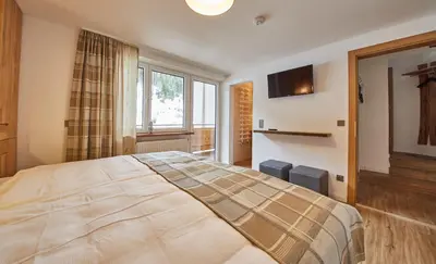 Ein Bett oder Betten in einem Zimmer der Unterkunft Saalbacher Perle Top 4