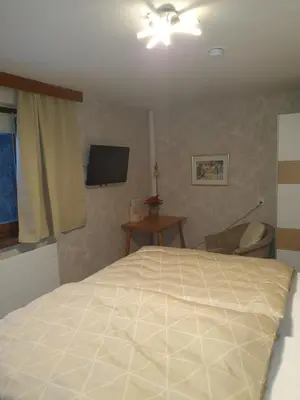 Ein Bett oder Betten in einem Zimmer der Unterkunft Haus Geigenmacher