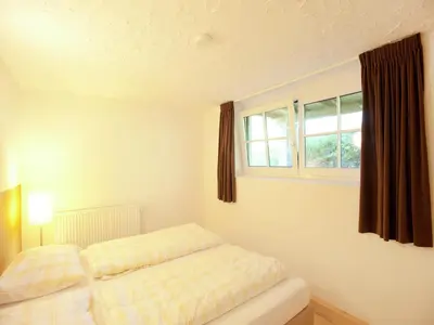 Ein Bett oder Betten in einem Zimmer der Unterkunft Chalet in the Wilder Kaiser ski area in Tyrol