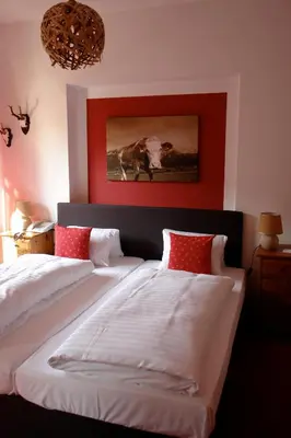 Ein Bett oder Betten in einem Zimmer der Unterkunft Hotel Gamshof