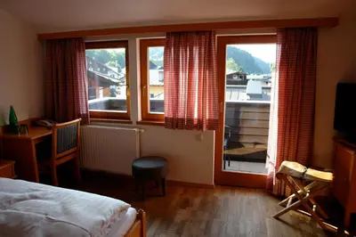 Ein Bett oder Betten in einem Zimmer der Unterkunft Hotel Gamshof