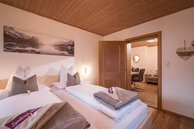 Ein Bett oder Betten in einem Zimmer der Unterkunft Landhaus Alpbach
