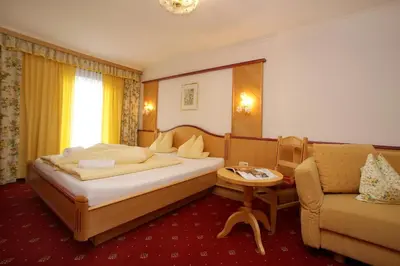 Ein Bett oder Betten in einem Zimmer der Unterkunft Altachhof Hotel und Ferienanlage - Jokercard im Sommer inklusive