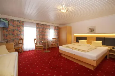 Ein Bett oder Betten in einem Zimmer der Unterkunft Altachhof Hotel und Ferienanlage - Jokercard im Sommer inklusive