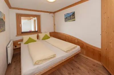 Ein Bett oder Betten in einem Zimmer der Unterkunft Apartments Rosenhof