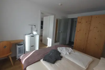 Ein Bett oder Betten in einem Zimmer der Unterkunft Gästehaus Waldrand Garni