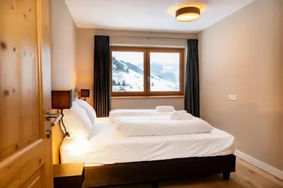 Ein Bett oder Betten in einem Zimmer der Unterkunft Gerlos Alpine Estate - Gerlos