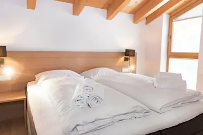 Ein Bett oder Betten in einem Zimmer der Unterkunft Residence Zillertal