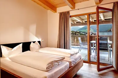 Ein Bett oder Betten in einem Zimmer der Unterkunft Gerlos Mountain Estate