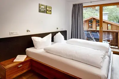 Ein Bett oder Betten in einem Zimmer der Unterkunft Gerlos Mountain Estate