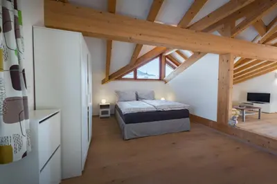 Ein Bett oder Betten in einem Zimmer der Unterkunft Alpinloft Tirol