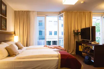 Ein Bett oder Betten in einem Zimmer der Unterkunft Hotel Stadt Kufstein