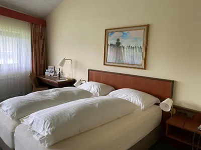 Ein Bett oder Betten in einem Zimmer der Unterkunft Landzeit Restaurant Angath