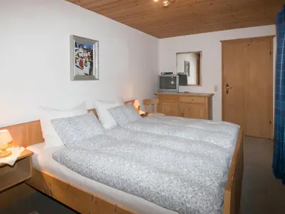 Ein Bett oder Betten in einem Zimmer der Unterkunft Landhaus Feller