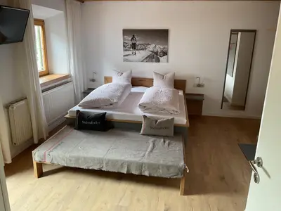 Ein Bett oder Betten in einem Zimmer der Unterkunft Landgasthof Dorfstadl